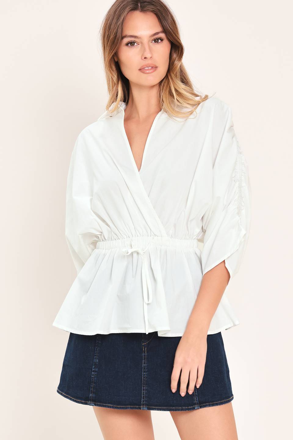 Elegant white peplum top