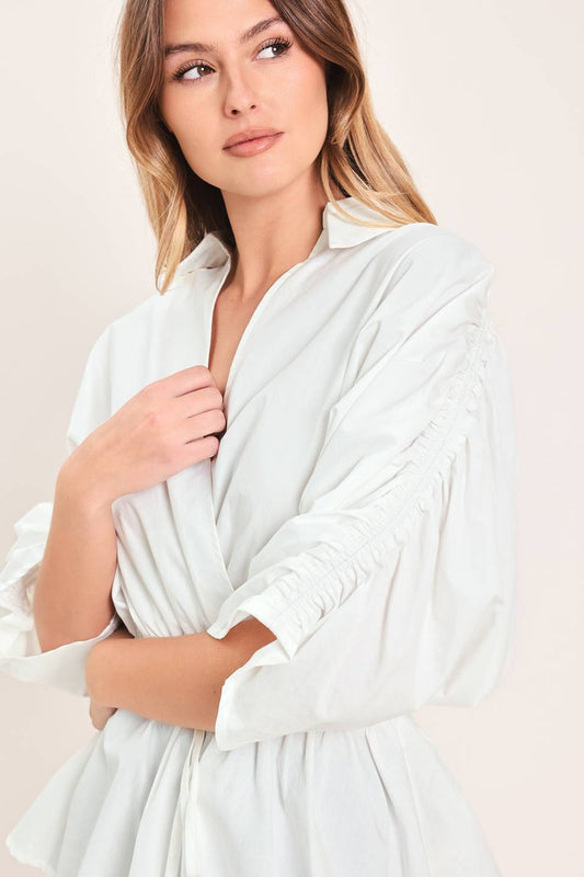 Elegant white peplum top