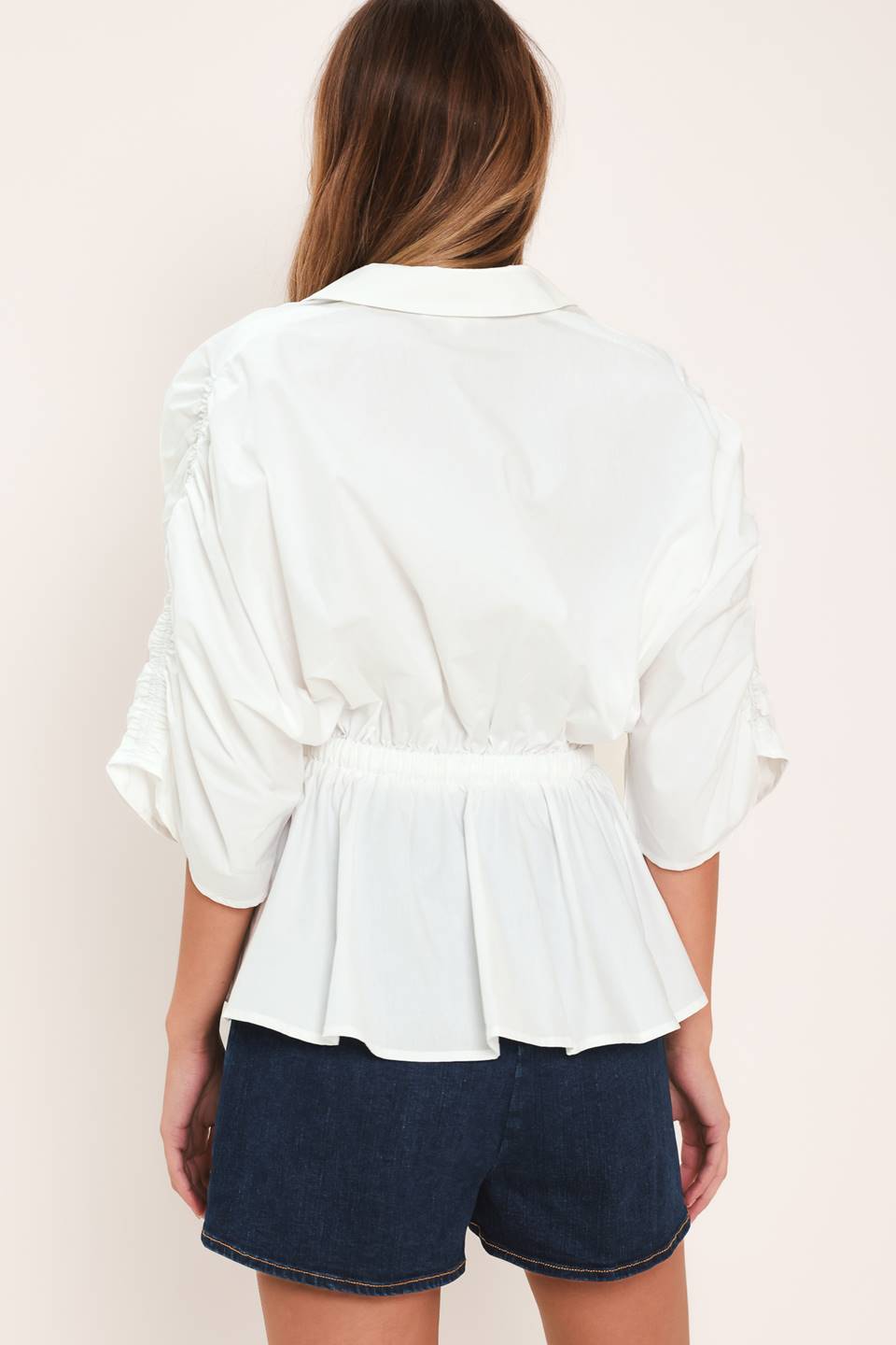 Elegant white peplum top