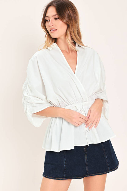 Elegant white peplum top