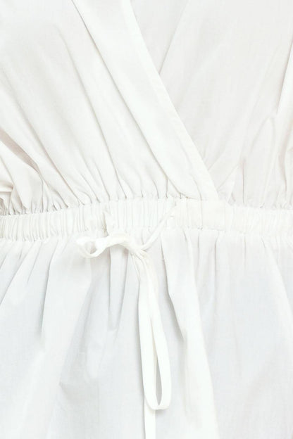 Elegant white peplum top