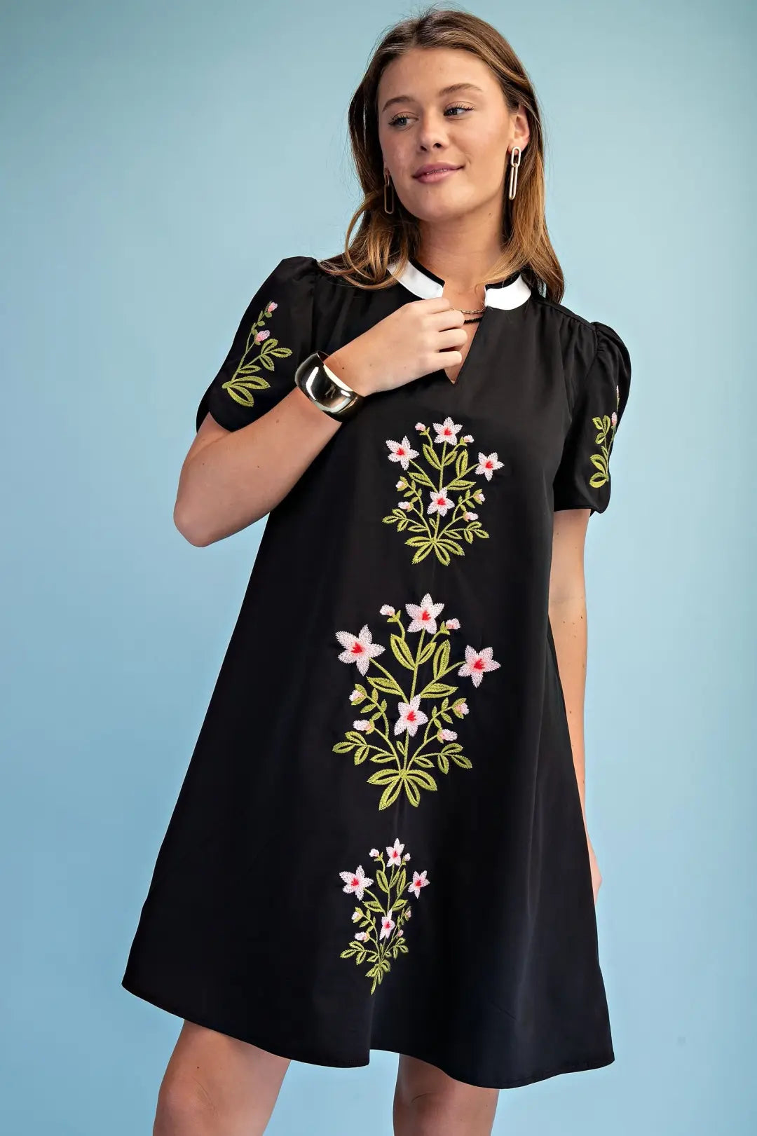 black mini dress with embroided flower