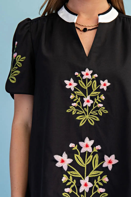 black mini dress with embroided flower