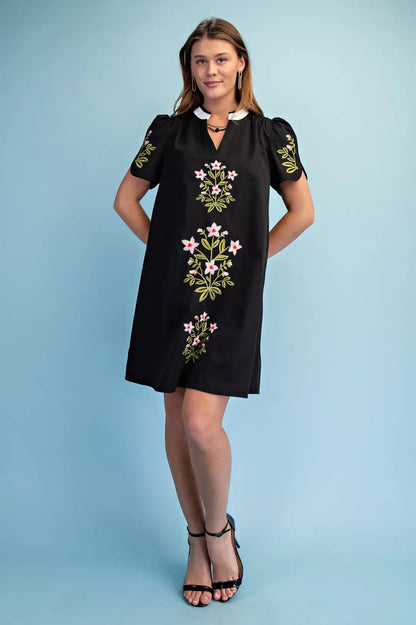 black mini dress with embroided flower