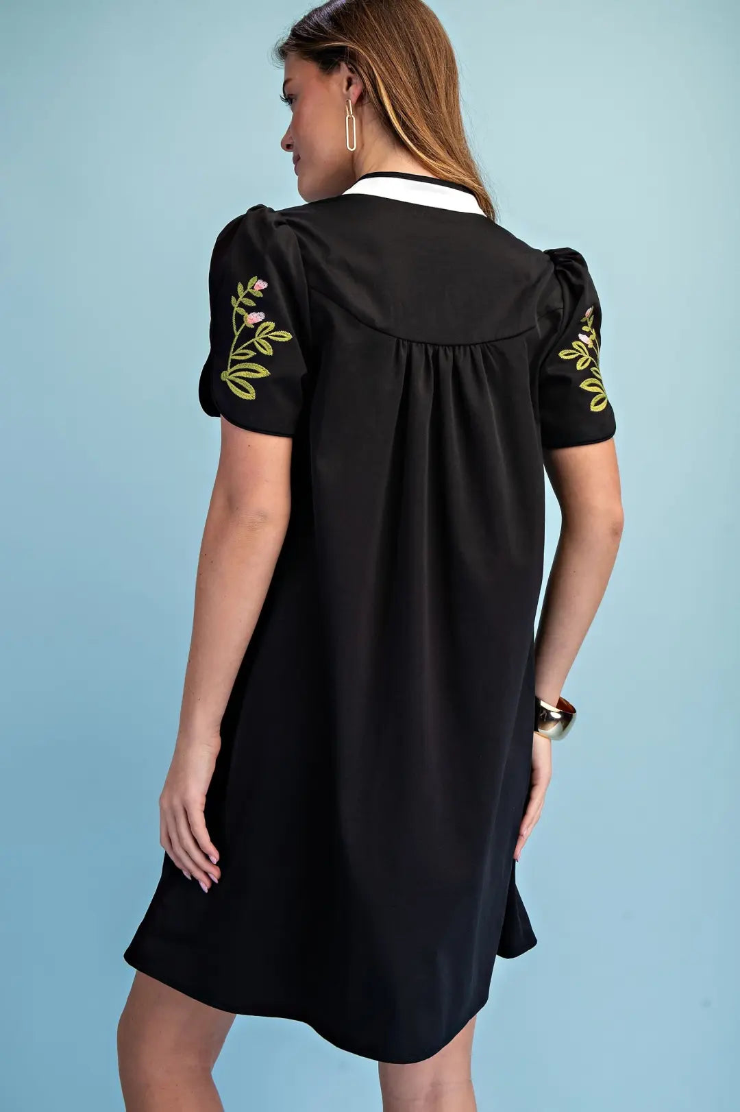 black mini dress with embroided flower