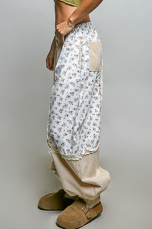 Patchwork pants crema con lineas sutiles.