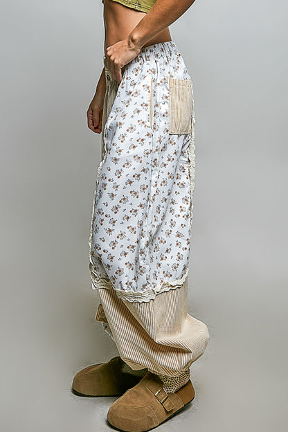 Patchwork pants crema con lineas sutiles.
